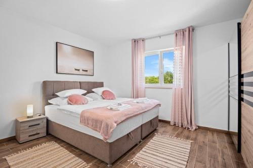 Postel nebo postele na pokoji v ubytování Villa Camelie