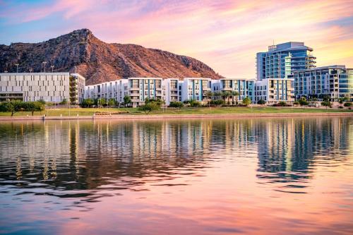 a view of a city with a reflection in the water at Fairfield Inn & Suites by Marriott Tempe in Tempe