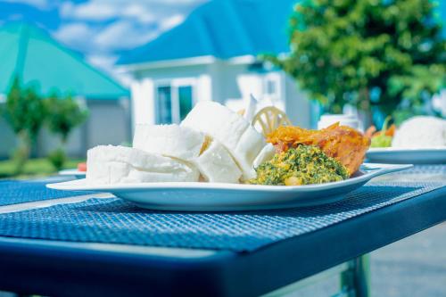 a plate of food sitting on a table at Teranga Lodge and Restaurant in Ihumwa