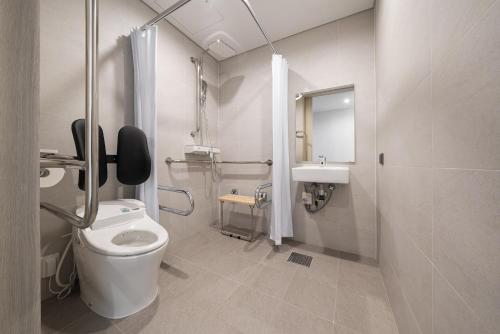 a bathroom with a toilet and a sink at Nine Tree by Parnas Seoul Dongdaemun in Seoul