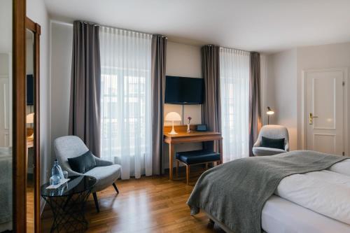 Ένα ή περισσότερα κρεβάτια σε δωμάτιο στο Romantik Hotel Kleber Post