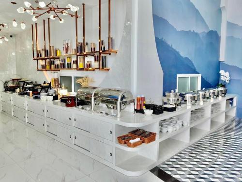 a store with a counter in a room at Moose Hotel Chiangmai in Chiang Mai