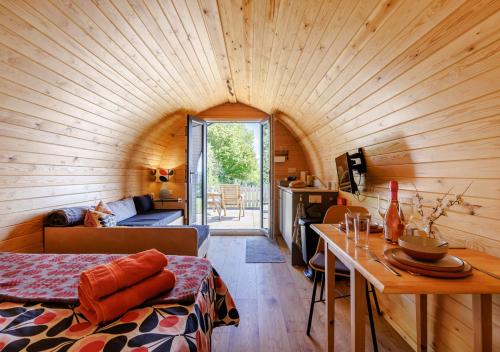 a room with a wooden ceiling in a tiny house at Clywedog in Cyffylliog