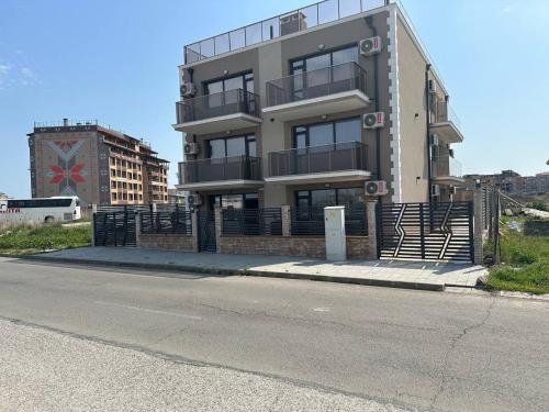 a building on the side of a street at Studios and Apartments Pomorie in Pomorie