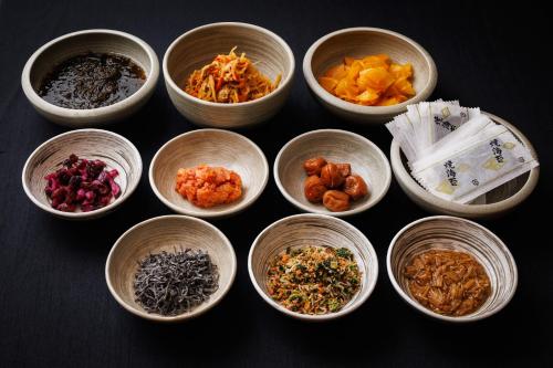 a group of bowls filled with different types of food at Hotel Metropolitan Kawasaki in Kawasaki