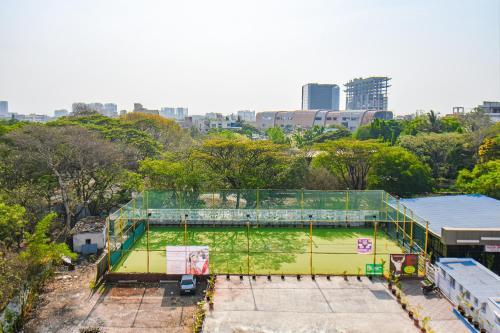 an overhead view of a tennis court in a city at FabHotel Prime Esta Inn - Nr Twin Tower, Viman Nagar in Pune