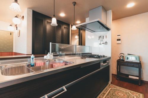 Una cocina o cocineta en ルグランみしま