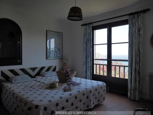 Postel nebo postele na pokoji v ubytování Meervilla Mallorca - Charmantes Ferienhaus mit phantastischem Meerblick in Canyamel