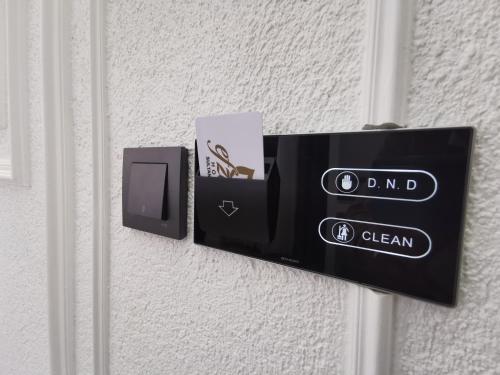 a external doorbell with a box on a wall at Efzen hotel in Istanbul