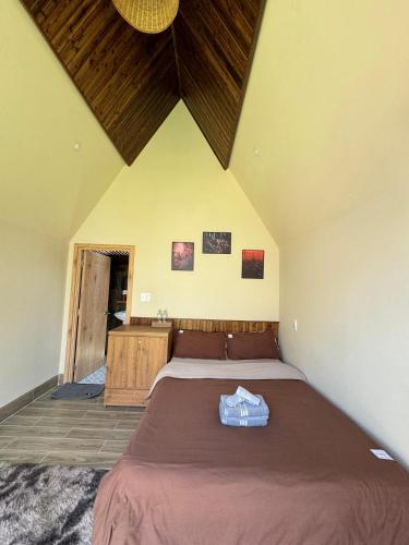 a bedroom with a large bed in a room at Nhà Sói Homestay Da Lat in Da Lat