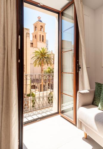 a room with a window and a view of a church at Myflats Luxury Cathedral in Alicante