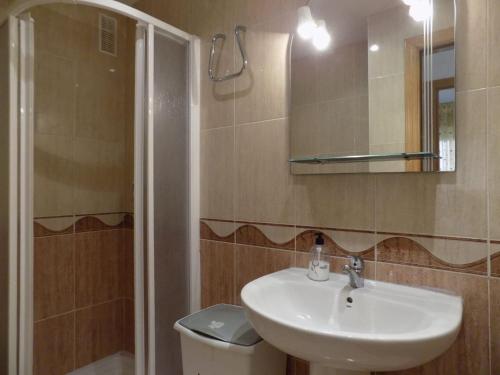 a bathroom with a sink and a toilet and a mirror at Holiday Costa marina 3MED006 in El Borseral
