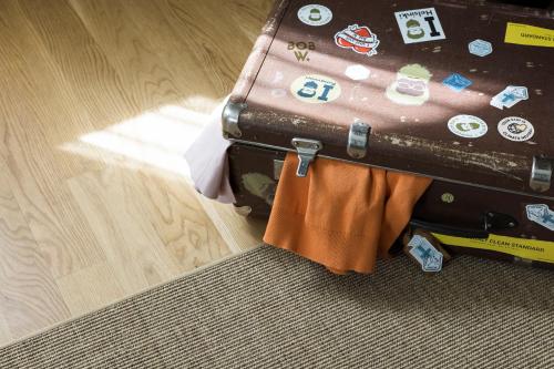 a piece of luggage sitting on the floor with at Bob W Sentralen in Oslo