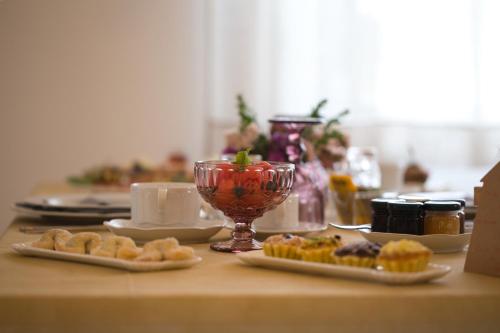 a table with plates of food and a cup of coffee at Le Casette di Giò in Monteodorisio