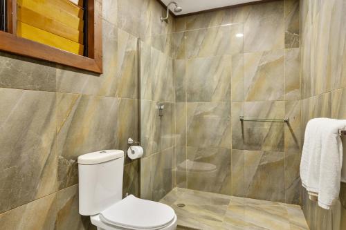 a bathroom with a toilet and a shower at Iririki Island Resort & Spa in Port Vila