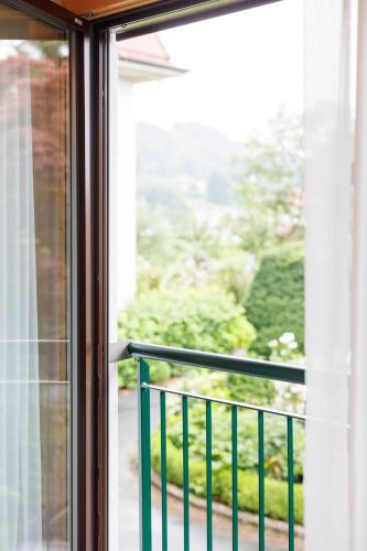 a window with a view of a balcony at Weinlandhof in Gamlitz