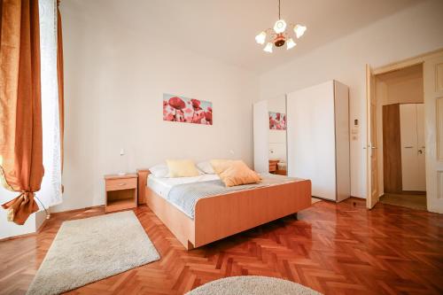 a bedroom with a bed and a mirror on the wall at Seafront Apartment Ičići in Ičići