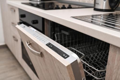 a dish washer and dryer in a kitchen at Seafront Apartment Ičići in Ičići
