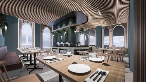 Una representación de un restaurante con mesas y sillas. en ARNI Skye Hotel, en Bangkok