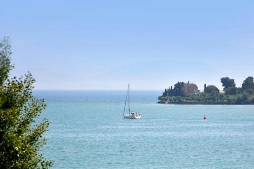 a sail boat in the middle of a large body of water at Hotel Orpheus in Gouvia