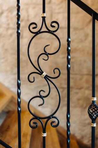 a black iron gate with a candle on it at Nolcken Lagerhaus in Kuressaare