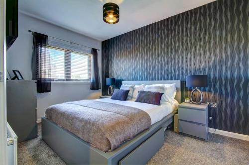En eller flere senge i et værelse på Ardfin Road - Prestwick The Open