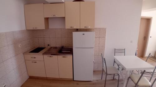 Kjøkken eller kjøkkenkrok på Dea Apartment