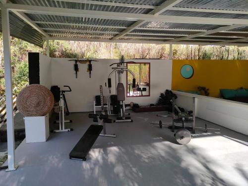 a gym with several exercise equipment in a room at VinSan Glamping & Wellness Centre in Eleoúsa