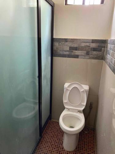 a bathroom with a toilet and a shower at Reel Place in Kayagan