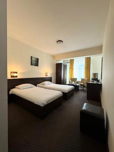 Ένα ή περισσότερα κρεβάτια σε δωμάτιο στο Hotel Yaky Center
