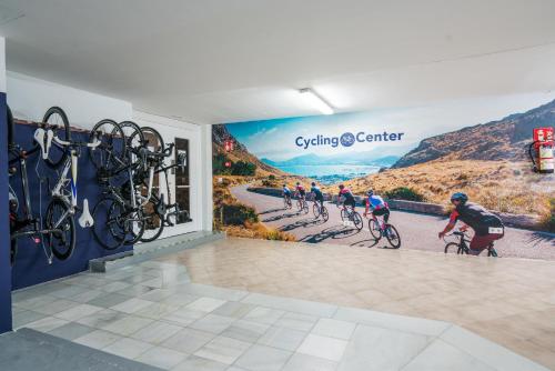 a group of people riding bikes in a wall mural at THB Maria Isabel - Adults Only in Playa de Palma