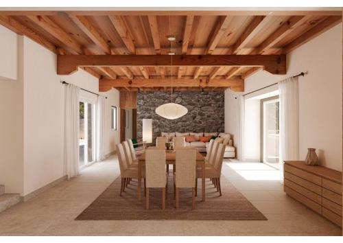 a dining room and living room with a table and chairs at Reverence Villas Caldelas in Antas de Ulla