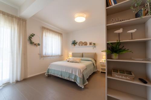 a bedroom with a bed and a book shelf at Le Casette di Giò in Monteodorisio