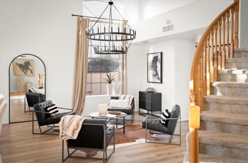 a living room with chairs and a table at Lakeside Views The Clubhouse at Arrowhead Pool in Glendale