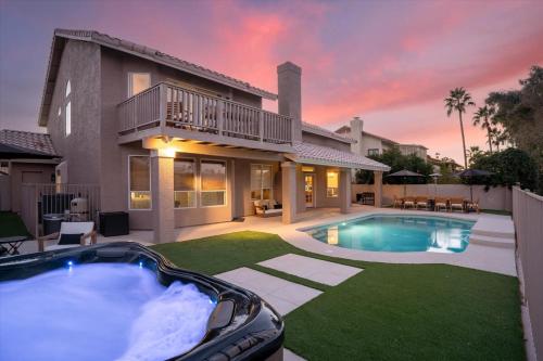 a house with a large swimming pool in the yard at Lakeside Views The Clubhouse at Arrowhead Pool in Glendale