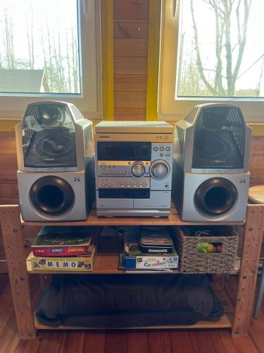 a shelf with two speakers and two radios at Joosepi Holiday House in Silla