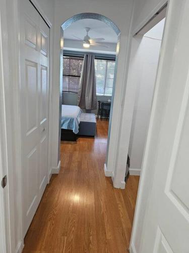 a hallway with a room with a bed and a door at D&N Property Rental in Miami