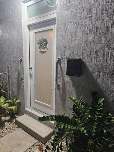a door with a plant in front of a building at D&N Property Rental in Miami