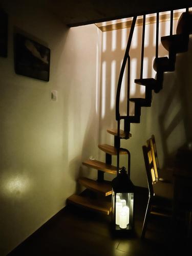 a staircase in a room with candles on the floor at Pokoje Gościnne Malinówka in Krościenko