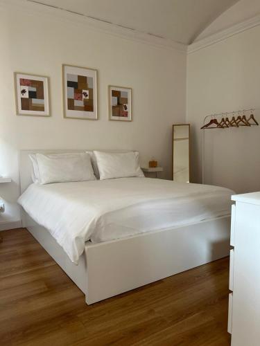 מיטה או מיטות בחדר ב-Casa Belfiore 1892 - bilocale