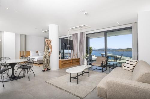 a woman is standing in a living room at Akana Loft in Bodrum City