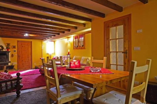 a dining room with a wooden table and chairs at bonfire house in San Giacomo