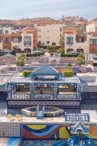 a boat dock with a slide in a marina at Faraana Heights Aqua Park in Sharm El Sheikh