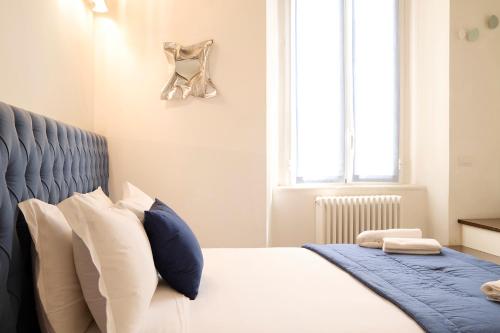 Una cama o camas en una habitación de Milan Retreats Duomo