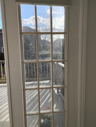a window with a view of a snow covered mountain at Bluenose Bed and Breakfast in Halifax