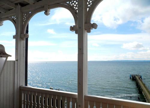 a view of the ocean from a gazebo at Fürstenhof - Ferienwohnung 204 in Sassnitz