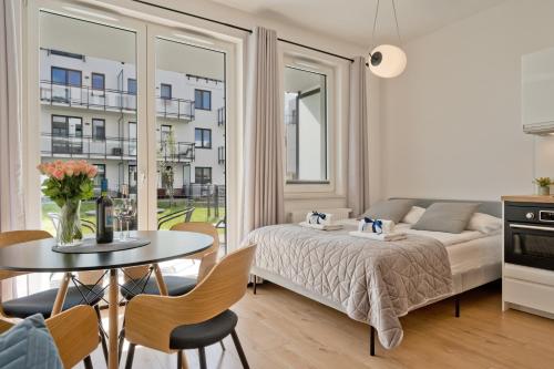 Postel nebo postele na pokoji v ubytování BlueApart Apartamenty Hotelowe Nexo