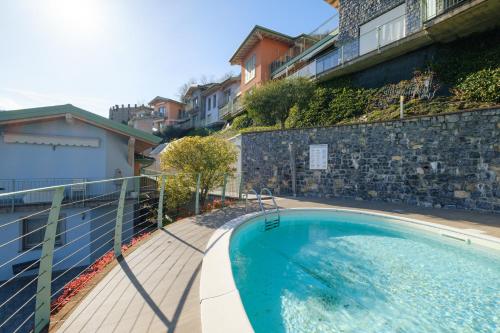 a large swimming pool next to a building at Artemisia in Parzanica