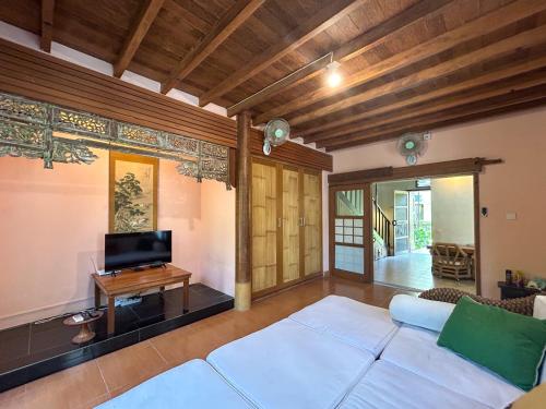 Ένα ή περισσότερα κρεβάτια σε δωμάτιο στο Sayang Taman Villas