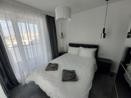 Letto o letti in una camera di Apartamenty Słoneczne Balkony